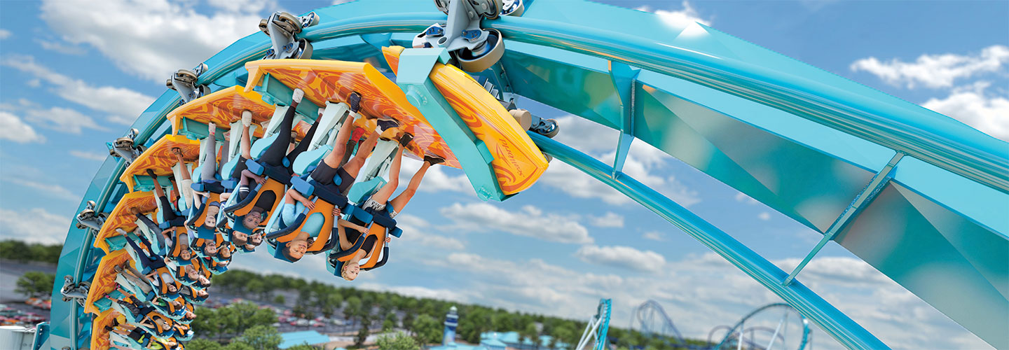 Photo of people riding an upside-down rollercoaster